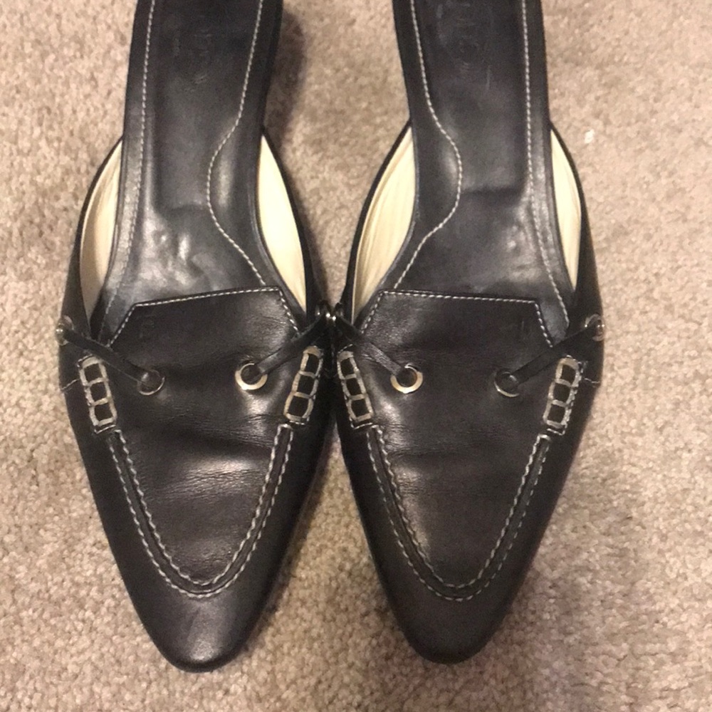 Black leather open back low loafer.